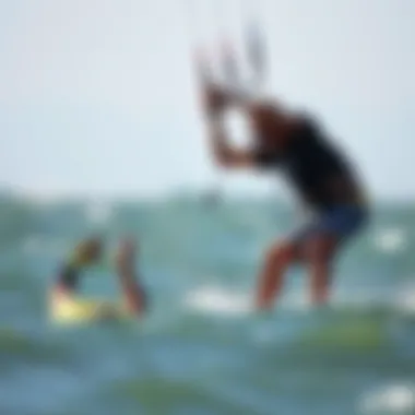 Instructor Demonstrating Backrolling Kiteboarding instructor demonstrating backrolling techniques on the water