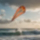 A high wind kite soaring above the ocean waves