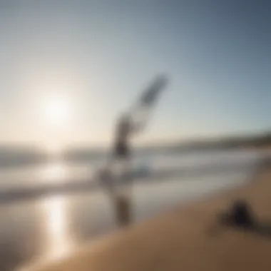 A serene beach setting with a kiteboarder preparing to launch a foil board.