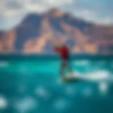Kiteboarding with stunning Oahu coastline in the background