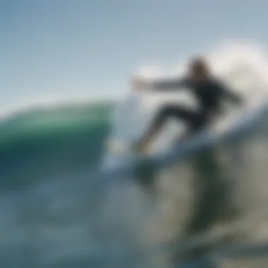 Surfer Riding Waves with Ear Protection Surfer in action with ear plugs visible