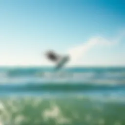 A kitesurfer performing an aerial trick above the waves