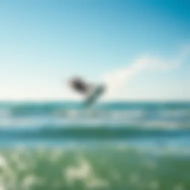 A kitesurfer performing an aerial trick above the waves