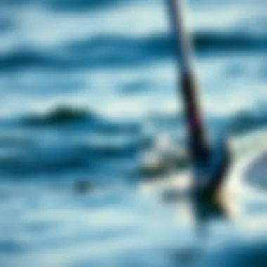 Foil Technology Enhancing Paddle Boarding Close-up of foil technology in action on water