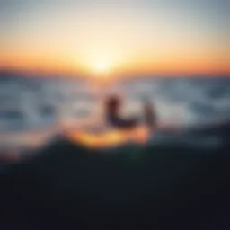 Kiteboarder navigating through nearshore waters during sunset