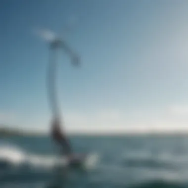 Kiteboarder in action utilizing a carbon fiber mast on the water during a sunny day