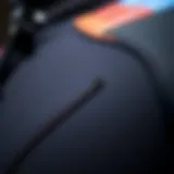 A close-up of a wetsuit showcasing its material and stitching