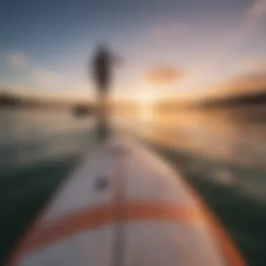 A stunning sunset backdrop with a wing sup board in the foreground