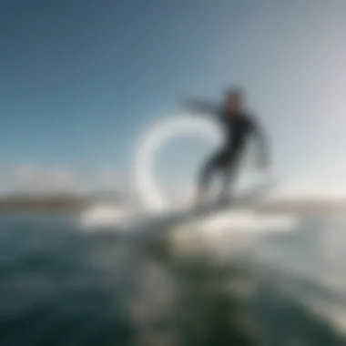 An aerial view of a rider practicing wing surfing on a calm sea